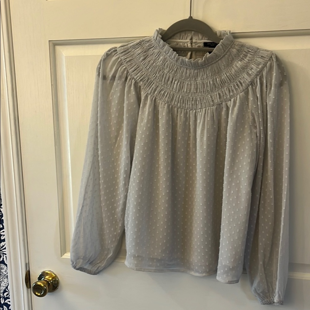 Ann Taylor Smocked blouse. It is a light, dove grey and is a Size XXSP